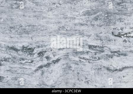 Fond de pierre réel. Fond gris de texture de pierre naturelle travertin pour une utilisation sur les carreaux de céramique ou comme fond numérique. Banque D'Images