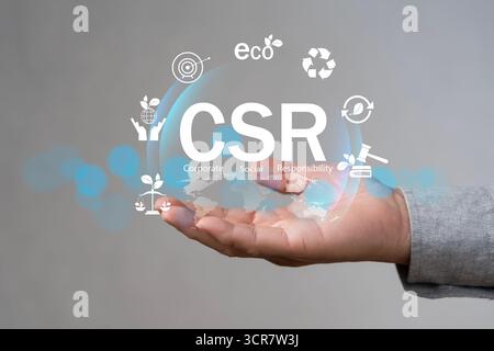 Responsabilité sociale des entreprises concept RSE avec des icônes écologiques au-dessus d'une main humaine, symbolisant la durabilité, le recyclage, la sensibilisation à l'environnement, éthique Banque D'Images