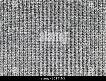 Gros plan d'un tissu gris avec un motif de lignes. Le tissu est fait de laine et a une texture floue Banque D'Images