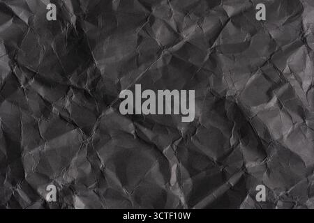Fond de papier froissé noir. Texture du papier froissé Banque D'Images