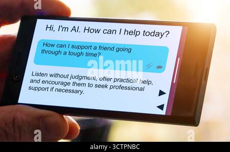 Comment puis-je soutenir un ami qui traverse une période difficile ? Questions pour l'intelligence artificielle sur l'écran du smartphone. Écoutez sans jugement, offrez Banque D'Images