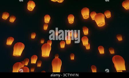Lanternes lumineuses flottant dans le ciel nocturne Banque D'Images