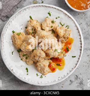 Chou-fleur pané avec sauce orange Banque D'Images
