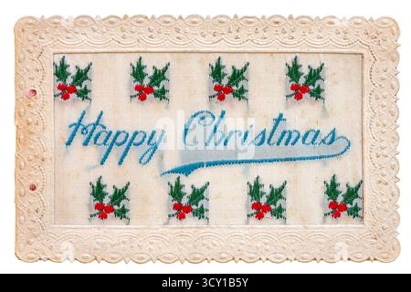 WW ! Carte postale brodée en soie de Noël avec des bouquets de houx et de baies : un symbole de la Couronne d'épines du Christ. Banque D'Images