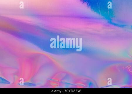 Une image abstraite présentant une transition fluide des couleurs violet aux couleurs roses, adaptée aux campagnes marketing créatives évoquant l'évolution et le mélange de conc Banque D'Images