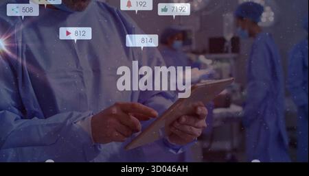 Tenir les données patient surveillées par le médecin sous des voyants chirurgicaux dans OU avec des icônes de notification Banque D'Images