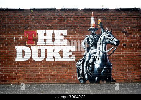 Murale sur le mur des brasseries Tennent Caledonian, Duke Street, Glasgow, Écosse, Royaume-Uni. Banque D'Images