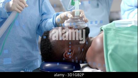 En tenant le masque d'anesthésie, le personnel en frottant pour fixer les voies respiratoires du patient dans la salle d'opération, avec un champ adhésif Banque D'Images