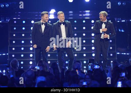 (De gauche à droite) Shane Filan, Nicky Byrne et Kian Egan de Westlife se produisant au Royal Albert Hall de Londres. Date de la photo : mardi 28 octobre 2025. Banque D'Images
