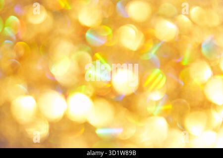 Cercle de bokeh avec fond doré scintille. Fond jaune scintillant Banque D'Images