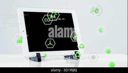 Affichage de tablette blanche reposant sur le support à la table de studio, avec des icônes hexagonales vertes flottantes Banque D'Images