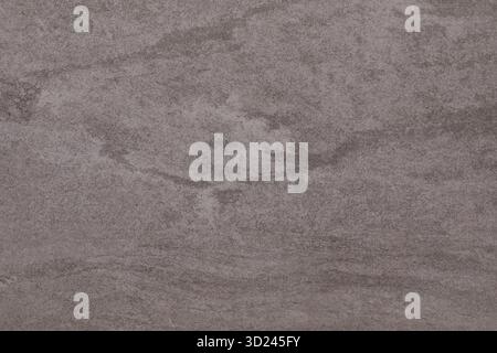 Surface texturée unique affichant des motifs naturels ressemblant au marbre d'une carrière dans la lumière de fin d'après-midi Banque D'Images