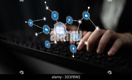 Une image conceptuelle montrant les mains tapant sur un clavier, entouré d'icônes flottantes qui symbolisent la connectivité et la communication dans un numérique Banque D'Images