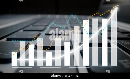 Cette image illustre la croissance de l'entreprise à l'aide de tableaux financiers et de graphiques placés sur un clavier d'ordinateur portable, symbolisant l'analyse, les informations basées sur les données et Banque D'Images