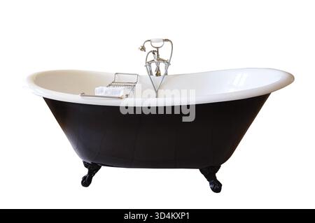 Baignoire vintage à pieds griffes noire et blanche isolée sur fond blanc, découpée Banque D'Images