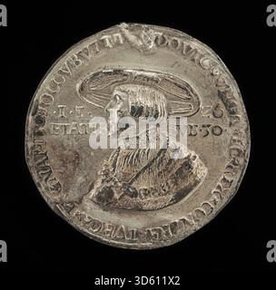Cette pièce ou médaille allemande du XVIe siècle représente Louis II, roi de Hongrie et de Bohême (1506-1526), montrant son profil sur l'avers, avec une inscription détaillée et des regalia royales, caractéristiques de la période numismatique Banque D'Images