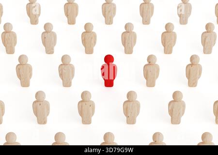 Individualité et concept de leadership. Figure en bois rouge se démarquant parmi les naturels sur fond blanc. Rendu 3D. Banque D'Images