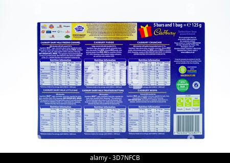 Irvine, Écosse, Royaume-Uni - 17 novembre 2025 : boîte de sélection Cadbury de Noël affichant le contenu des icônes graphiques et des symboles pertinents pour le produ Banque D'Images