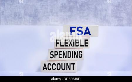 Il y a un compte de dépenses flexible FSA sur les blocs de bois. Banque D'Images
