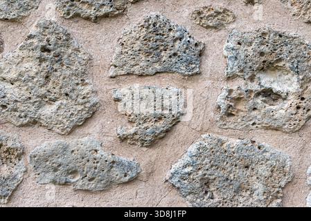 Fond sans couture de texture de façade de mur de bloc de pierre naturelle rugueuse Banque D'Images