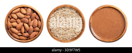 Amandes entières, moulues, et beurre d'amande, dans des bols en bois. De gauche à droite amandes séchées avec peau, amandes non pelées moulues et en pâte. Banque D'Images