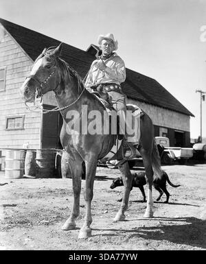 Bing Crosby habillé comme un cow-boy, sur un cheval (Paramount, années 1940) photo publicitaire Banque D'Images
