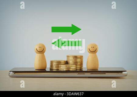 Pions en bois et piles de pièces de monnaie avec des flèches sur téléphone portable - concept de transaction et d'échange d'argent Banque D'Images