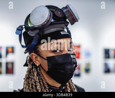 Eyes of Xodohtronu, artiste 3D et coiffeuse virtuelle à l'exposition Black Lines of Code à Londres. Banque D'Images