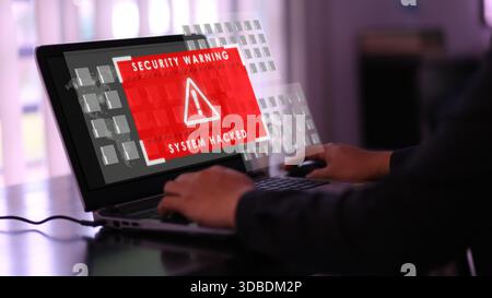 Alerte d'avertissement de sécurité sur l'écran de l'ordinateur portable indiquant que le système est piraté Banque D'Images