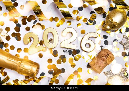Allemagne - 20 décembre 2025 : PHOTOMONTAGE, l'année 2026 peut être vu comme un numéro décoratif entre confettis, banderoles et décorations de la Saint-Sylvestre. L'image symbolique représente les célébrations de la fin de l'année, du nouvel an et du nouvel an *** FOTOMONTAGE, Die Jahreszahl 2026 ist als dekorative Zahl zwischen Konfetti, Luftschlangen und Silvesterdekoration zu sehen. DAS Symbolbild steht für den Jahreswechsel, Neujahr und Silvesterfeierlichkeiten Banque D'Images