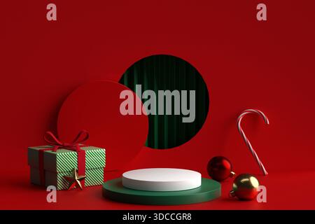 Affichage festif de produits de Noël sur un fond rouge et vert avec un podium blanc, une boîte cadeau rayée, une canne à bonbons et des ornements. Idéal pour les vacances Banque D'Images