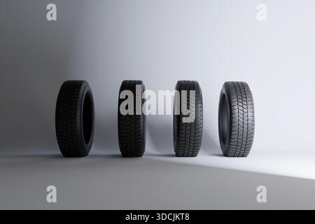 Quatre pneus d'une roue de voiture sur un fond blanc. Remplacement des pneus d'hiver neufs. Sécurité et contrôle, concept Banque D'Images