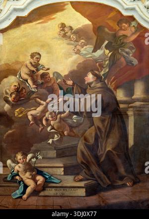 POSITANO, ITALIE - 7 OCTOBRE 2025 : la peinture d'Antoine de Padoue avec l'enfant Jésus et les anges dans la cathédrale Santa Maria Assunta Banque D'Images