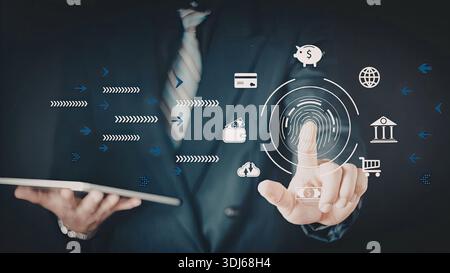 Un homme d'affaires en costume interagit avec une interface numérique sur une tablette, entourée de diverses icônes technologiques et financières. L'image emphas Banque D'Images