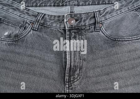 détail d'une paire de jeans gris Banque D'Images