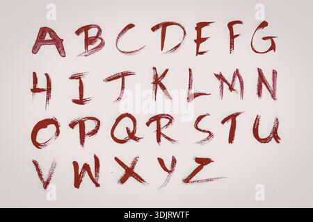 Image montrant des lettres manuscrites de l'alphabet à l'encre rouge, affichées sur un fond blanc. Chaque lettre est écrite dans un coup de pinceau décontracté Banque D'Images