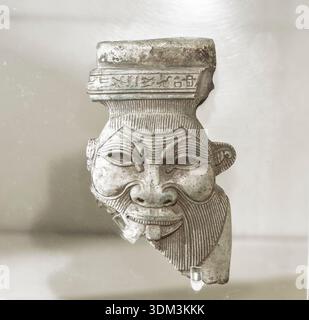Petite tête de statue de l'ancien Dieu égyptien Bes exposée à Kingston Lacy, Dorset, Royaume-Uni le 2 février 2026 Banque D'Images