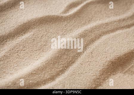 Fond de sable de plage. Surface texturée naturelle du bord de mer Banque D'Images
