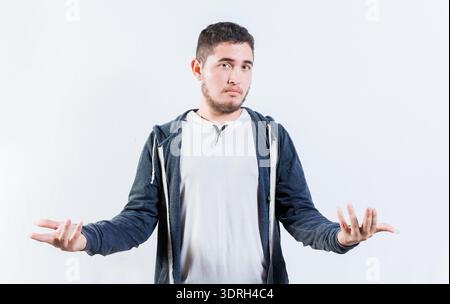 Personne perplexe écartant les mains isolées. Jeune homme sans tête aux bras ouverts Banque D'Images
