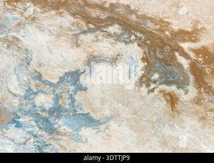 Vue aérienne de motifs tourbillonnants de tons de terre clairs et sombres, créant un effet marbré à travers le paysage, Islande. Banque D'Images