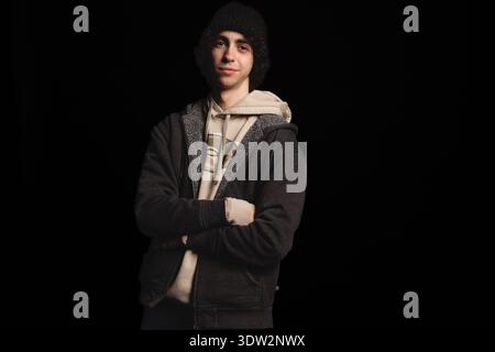 Portrait d'un adolescent masculin portant un pull Champion Banque D'Images