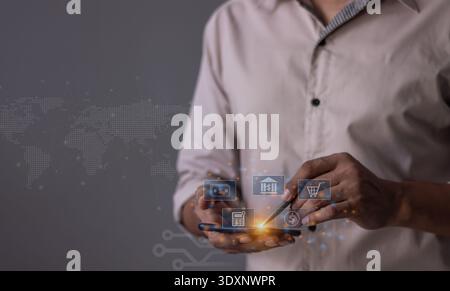 Jeune homme avec la main mobile de smartphone tenant un stylo touchant pour visualiser la croissance de l'argent L'écran du téléphone affiche des graphiques et des graphiques montrant l'augmentation Banque D'Images