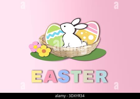 Joli lapin de Pâques assis dans un panier avec des œufs décorés colorés et des fleurs de printemps sur fond festif rose doux. Banque D'Images