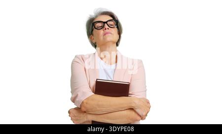 Professeur de femme senior sérieuse tenant le livre avec des lunettes Banque D'Images
