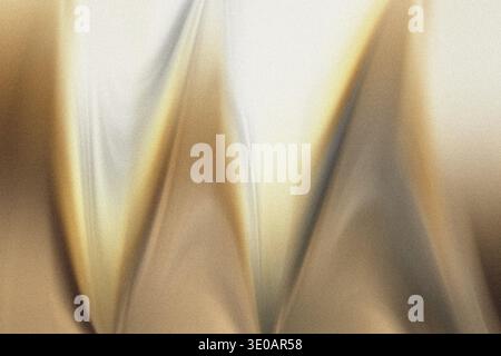 Une image abstraite en gros plan présentant une texture granuleuse avec des motifs ondulés diagonaux dans les tons de brun, or et blanc cassé, créant une dynamique et wa Banque D'Images