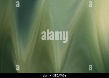 Une image abstraite richement texturée avec des tons verts profonds et clairs mélangés avec des notes de jaune pâle ou de citron vert. La surface affiche un g distinct Banque D'Images