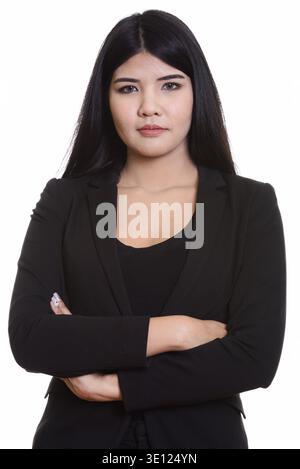 Studio shot of young Asian businesswoman with arms crossed Banque D'Images