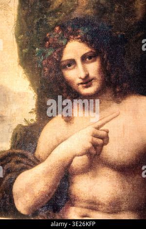 PARIS, FRANCE - MARS 2026 : Léonard de Vinci peinture Bacchus - Saint Jean Baptiste, 1519. Huile sur bois transféré sur toile, 177x115 cm, Louvre M Banque D'Images