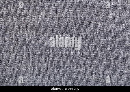 Fond textile - fils tissés en tricot jersey de laine gris gros plan Banque D'Images