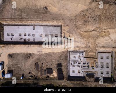 Vue aérienne de haut en bas du site de construction de la fondation du bâtiment Banque D'Images